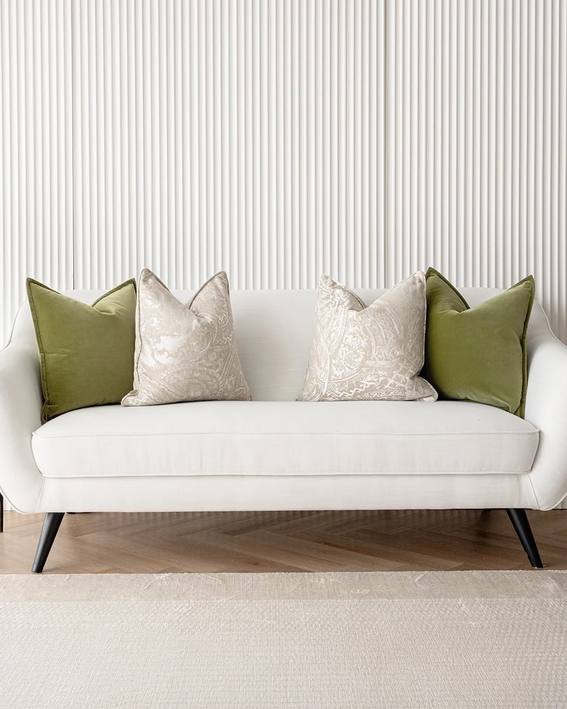 Juniper Bundle cushion in green, beige and silver, shown in a lifestyle front view as image 2