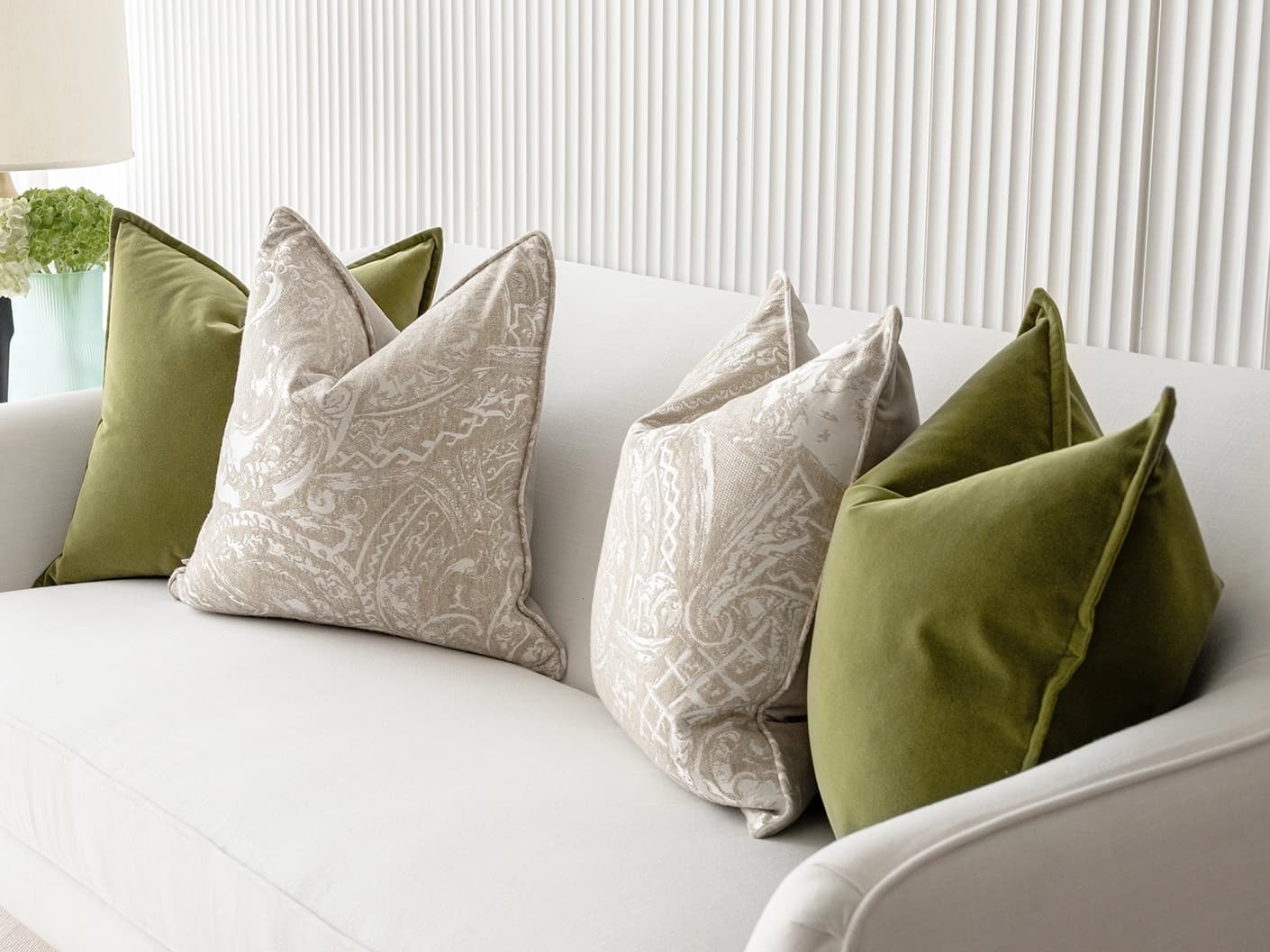 Juniper Bundle bundle cushions in green, beige and silver, shown in a lifestyle front view