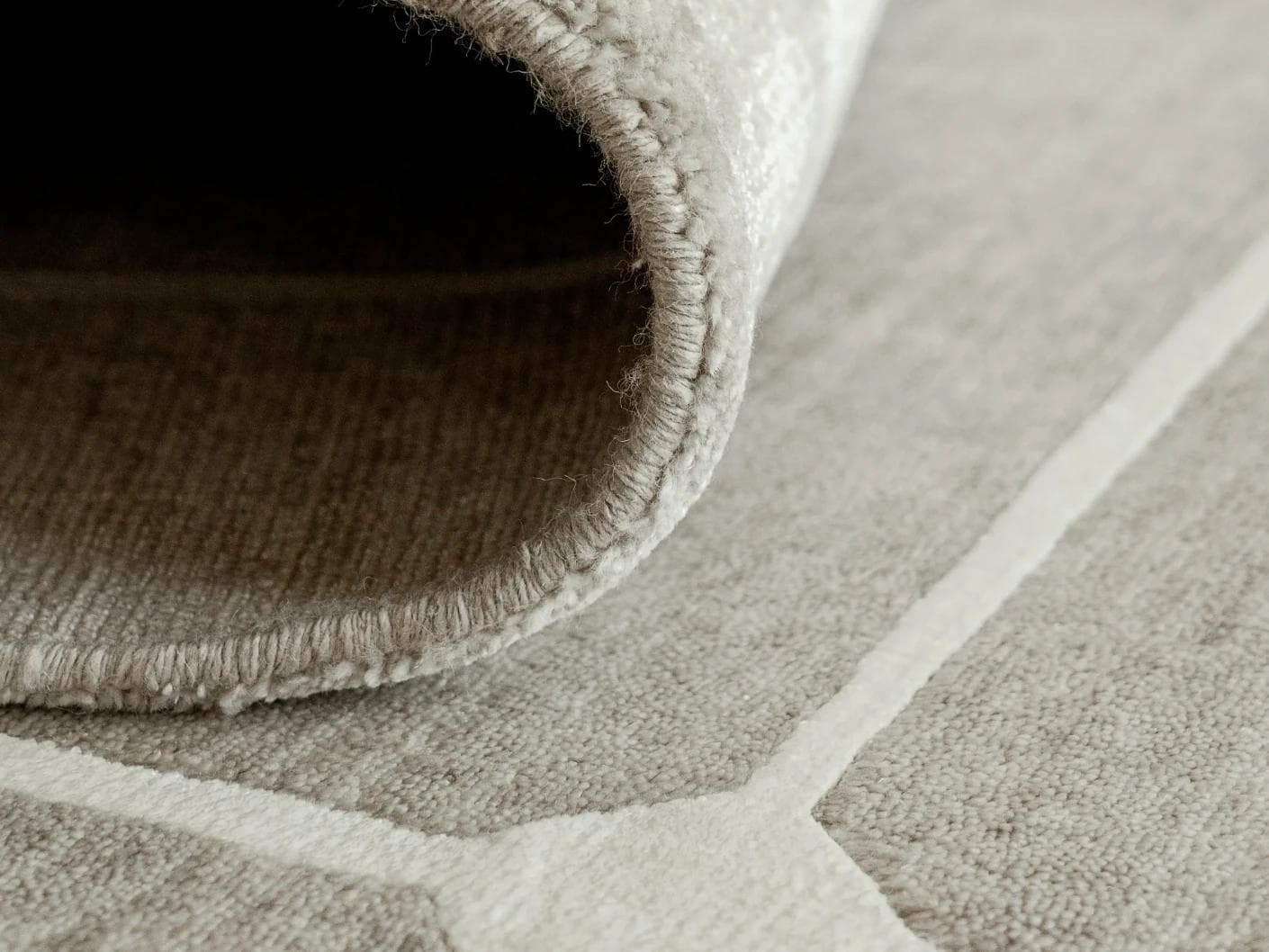 Justin Dune carpets in grey, shown in a product close-up as image 2