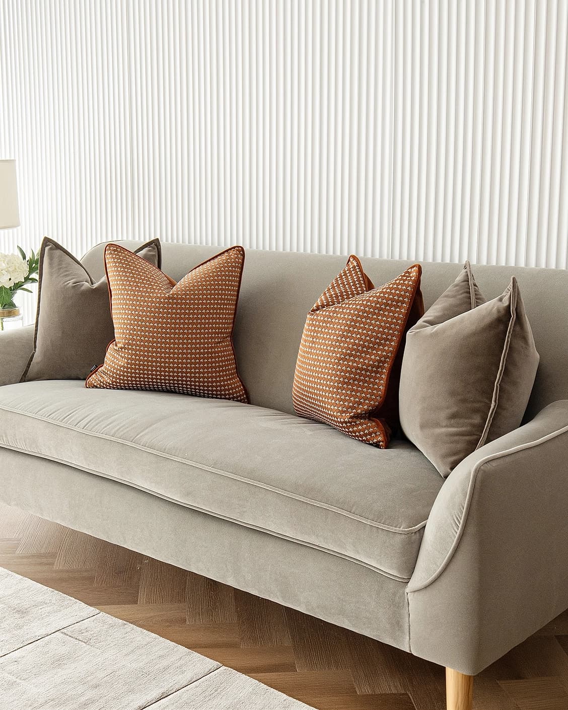 Kalysta Bundle cushion in brown and orange, shown in a lifestyle right view as image 2