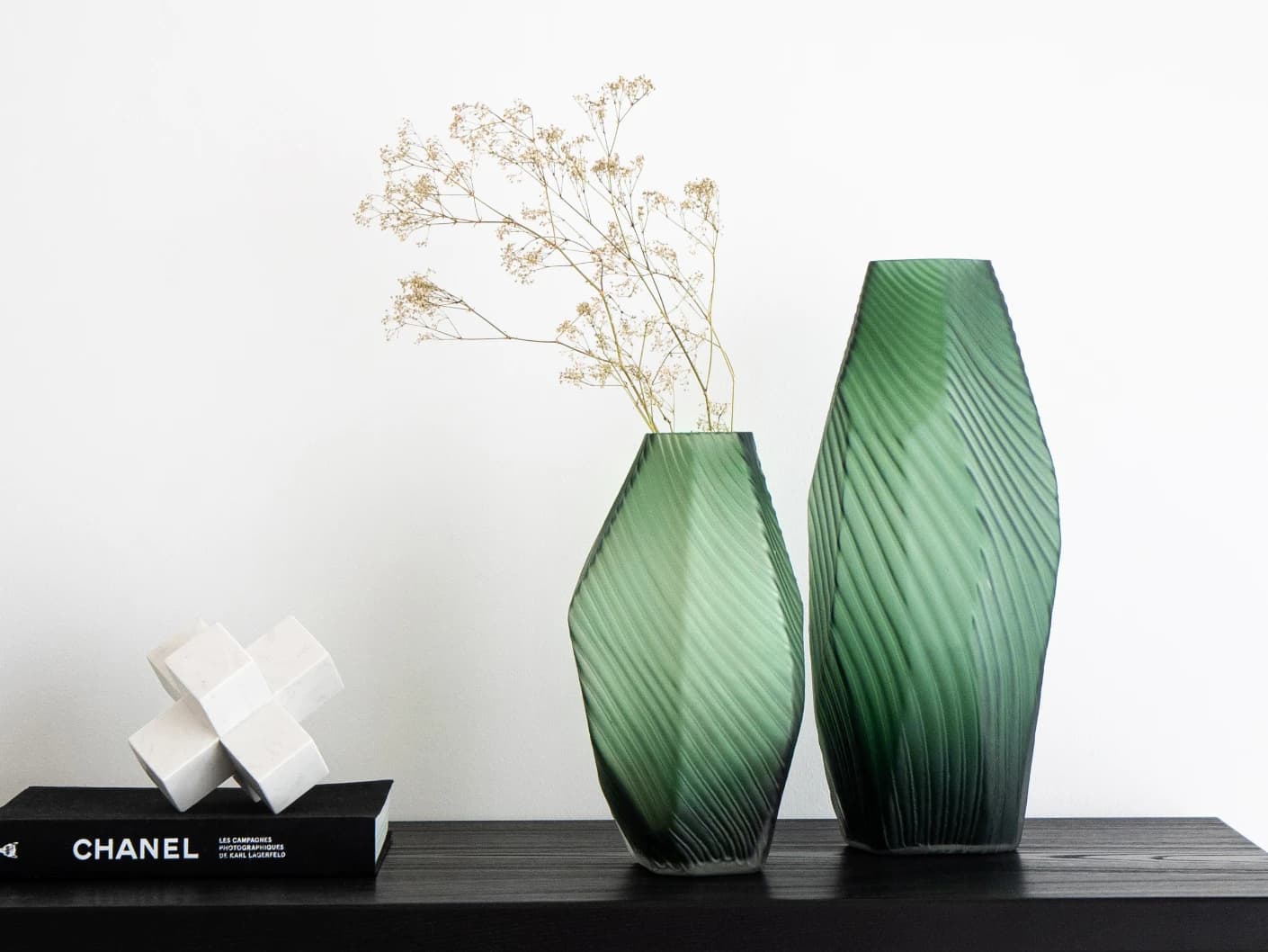 Keira Bundle vases in green, shown in a lifestyle front view