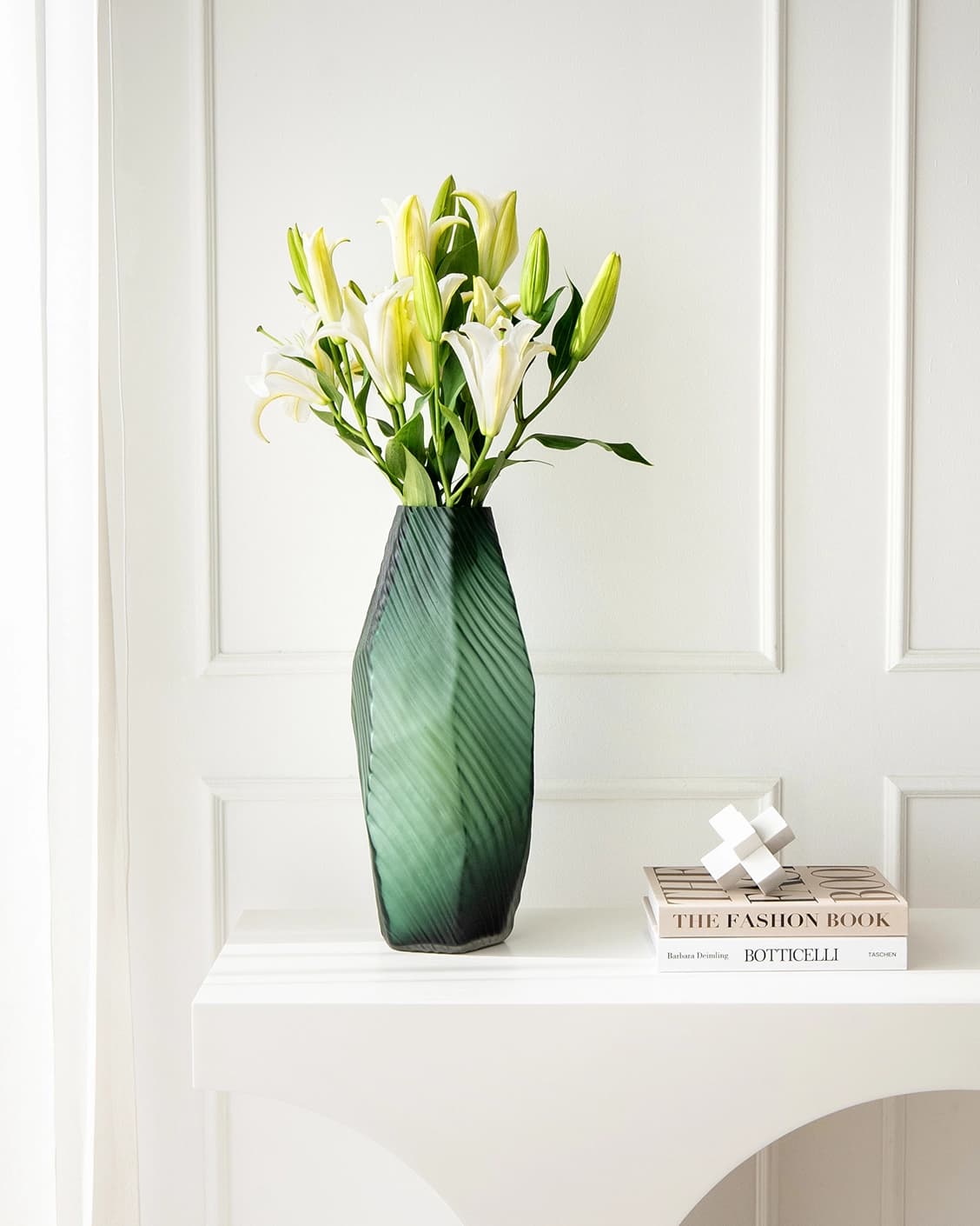 Keira Storms vases in green, shown in a lifestyle front view as image 2