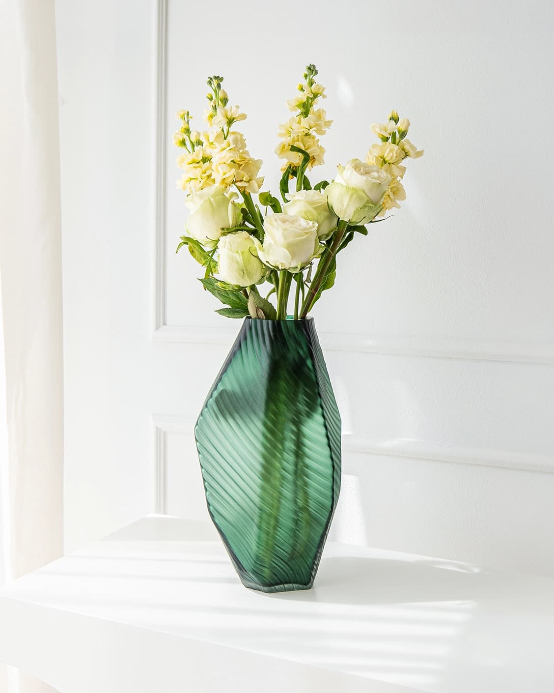 Keira Storms II vases in green, shown in a lifestyle right view as image 2