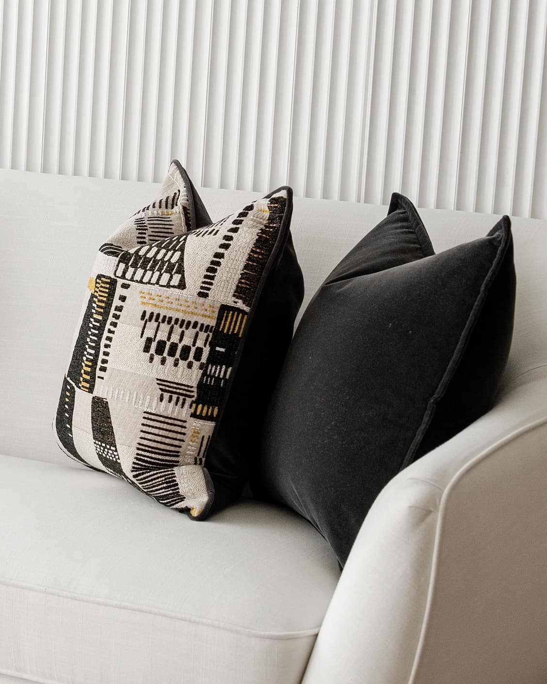 Krishna Bundle cushion in black, grey and beige, shown in a lifestyle right view as image 6