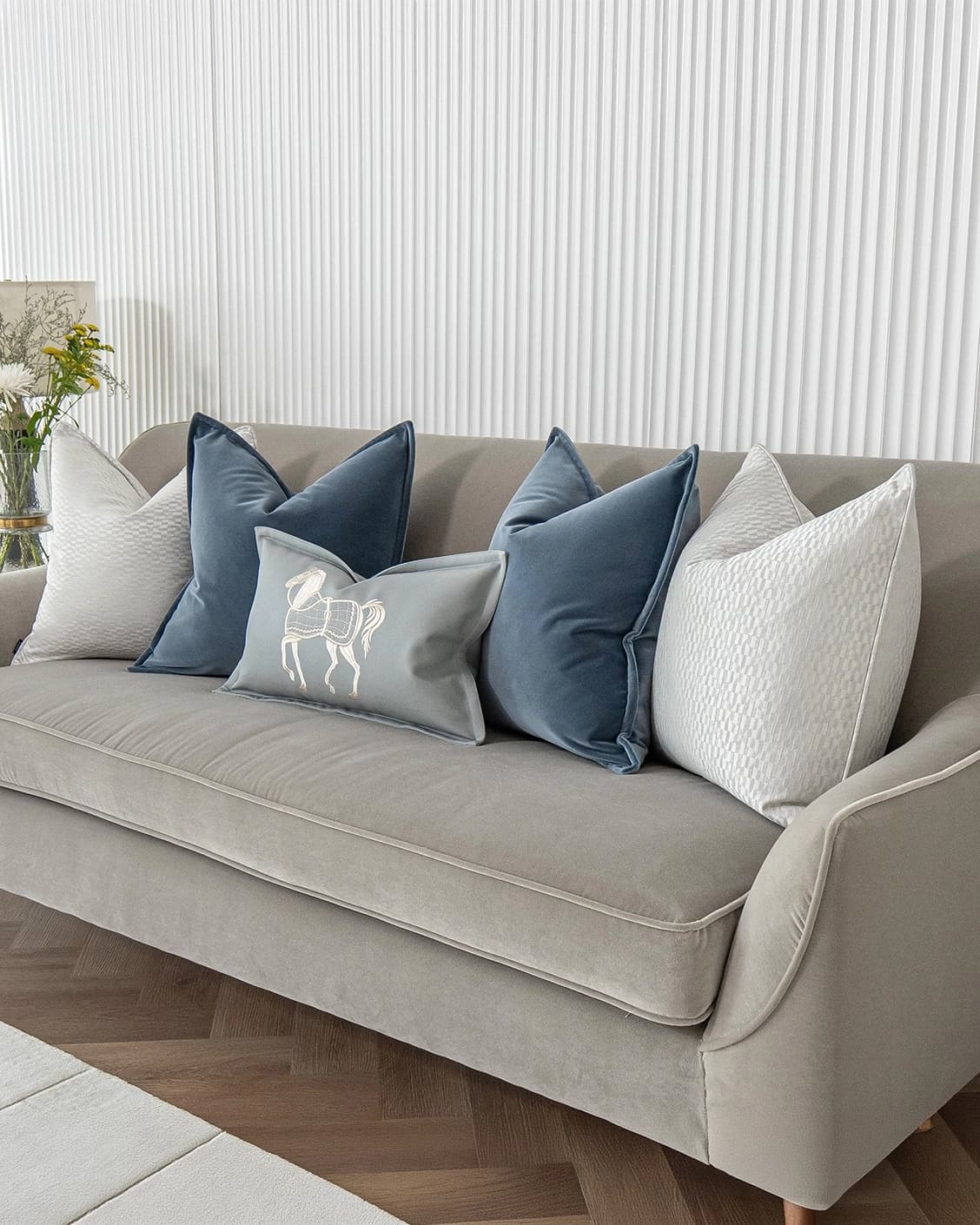 Kristal Bundle cushion in blue, silver and white, shown in a lifestyle right view as image 2