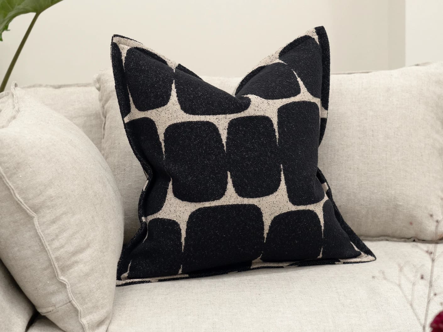 Kyomi Steele single cushions in charcoal, shown in a lifestyle front view