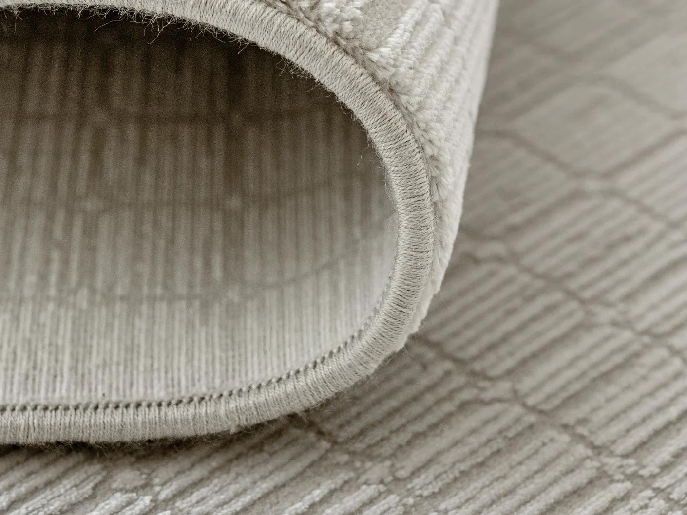 Laino Alba carpet in ivory and grey, shown in a product close-up as image 12