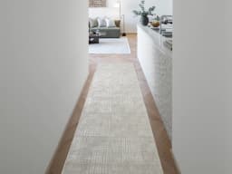 Laino Ashton carpet in ivory and grey, shown in a lifestyle front view