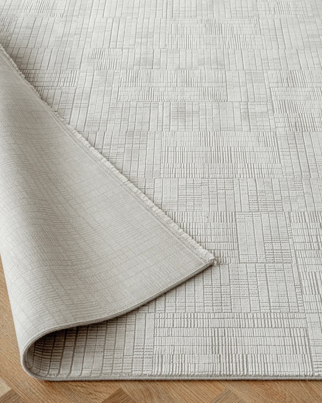 Laino Ashton carpet in ivory and grey, shown in a product close-up as image 11