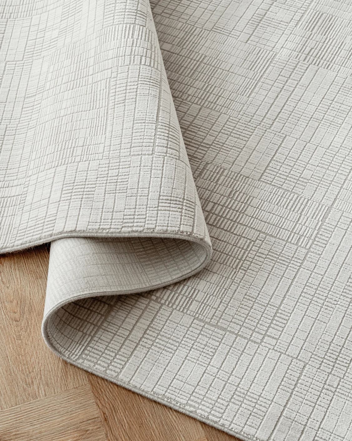 Laino Ashton carpet in ivory and grey, shown in a product close-up as image 12