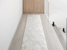 Laino Ashton Runners carpet in ivory and grey, shown in a lifestyle front view