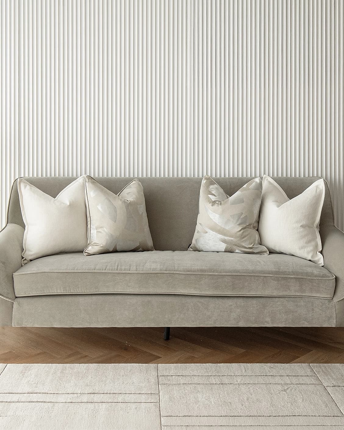 Landers Bundle cushion in white, silver and beige, shown in a lifestyle front view as image 2