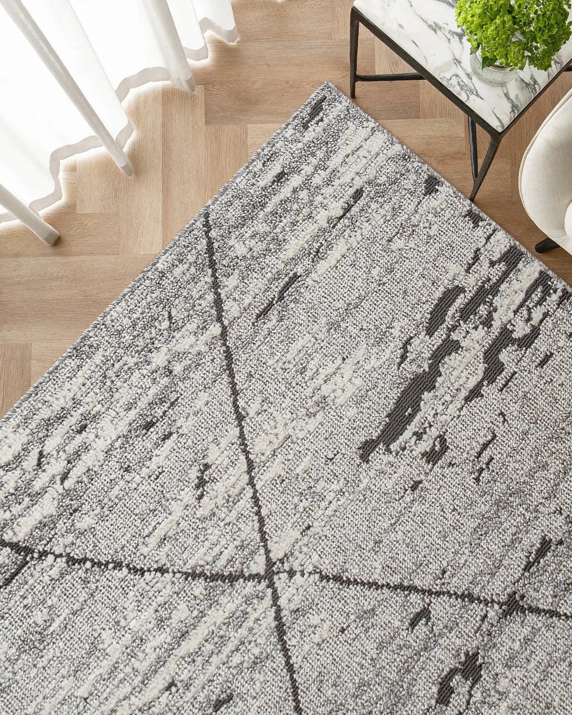 Leila Ashton carpet in charcoal, shown in a lifestyle top view as image 2