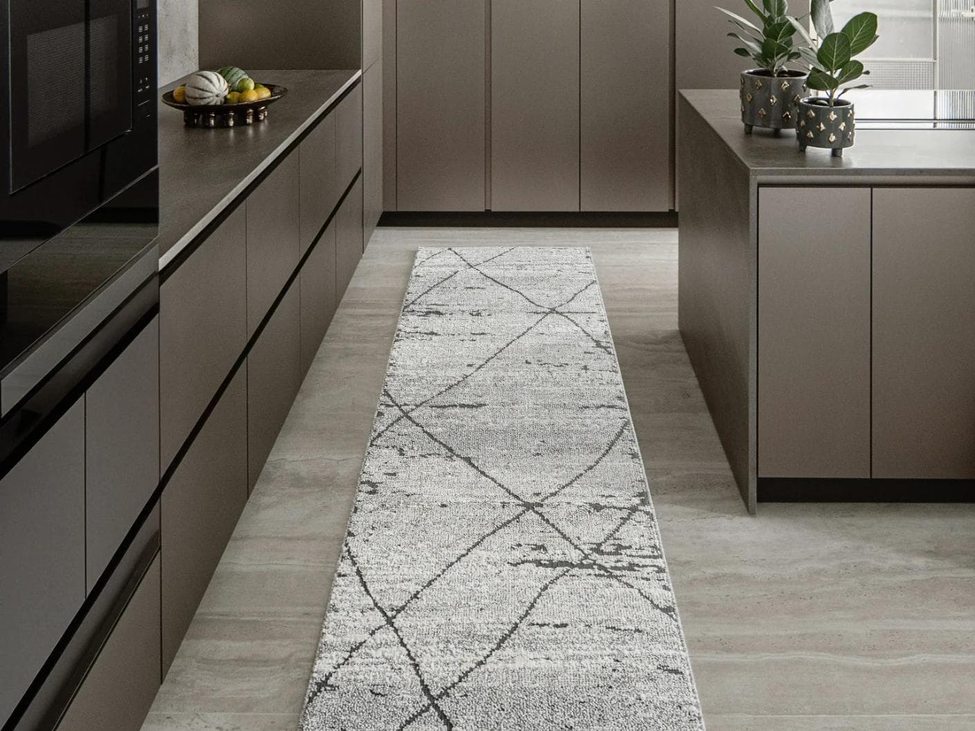 Leila Ashton carpets in charcoal, shown in a lifestyle front view as image 1