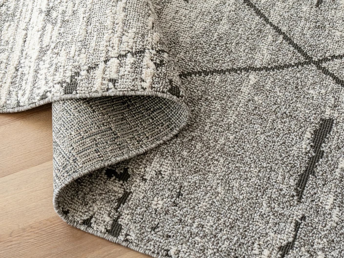 Leila Ashton carpets in charcoal, shown in a product close-up view
