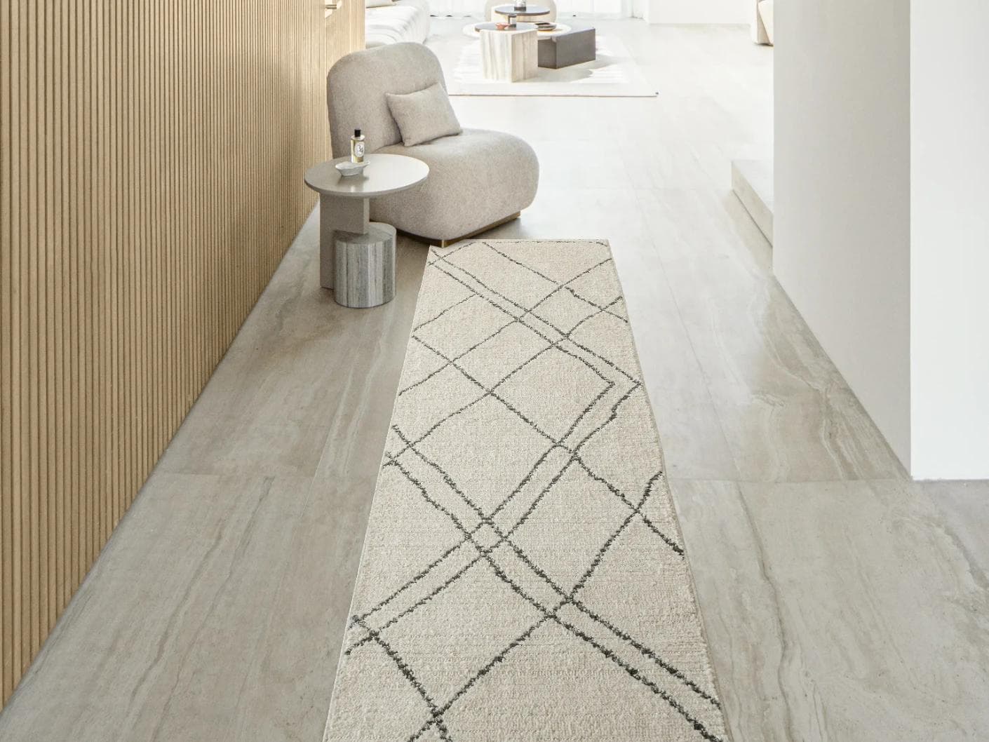Leila Bianca carpets in beige and charcoal, shown in a lifestyle front view as image 1