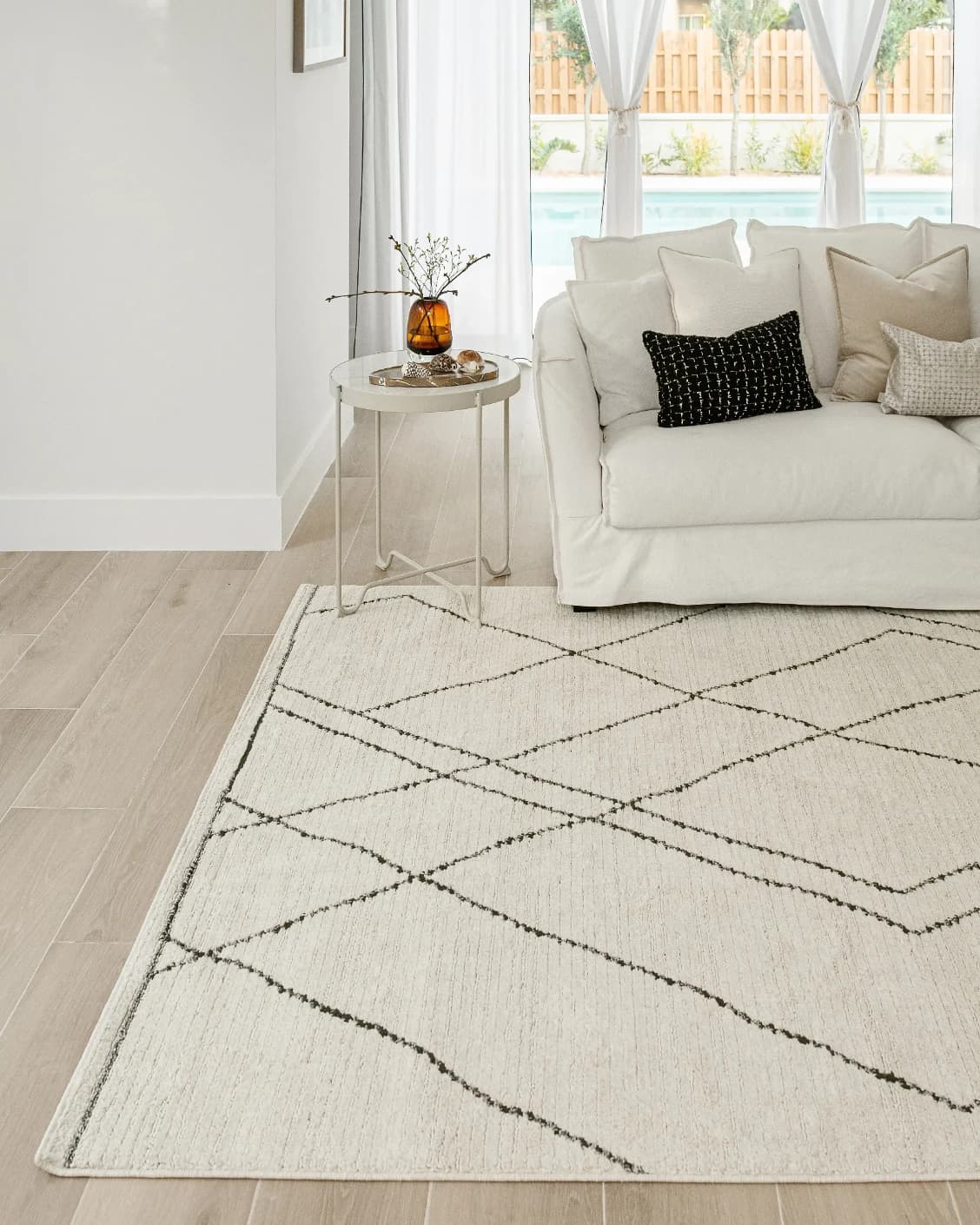 Leila Bianca carpet in beige and charcoal, shown in a lifestyle front view as image 5