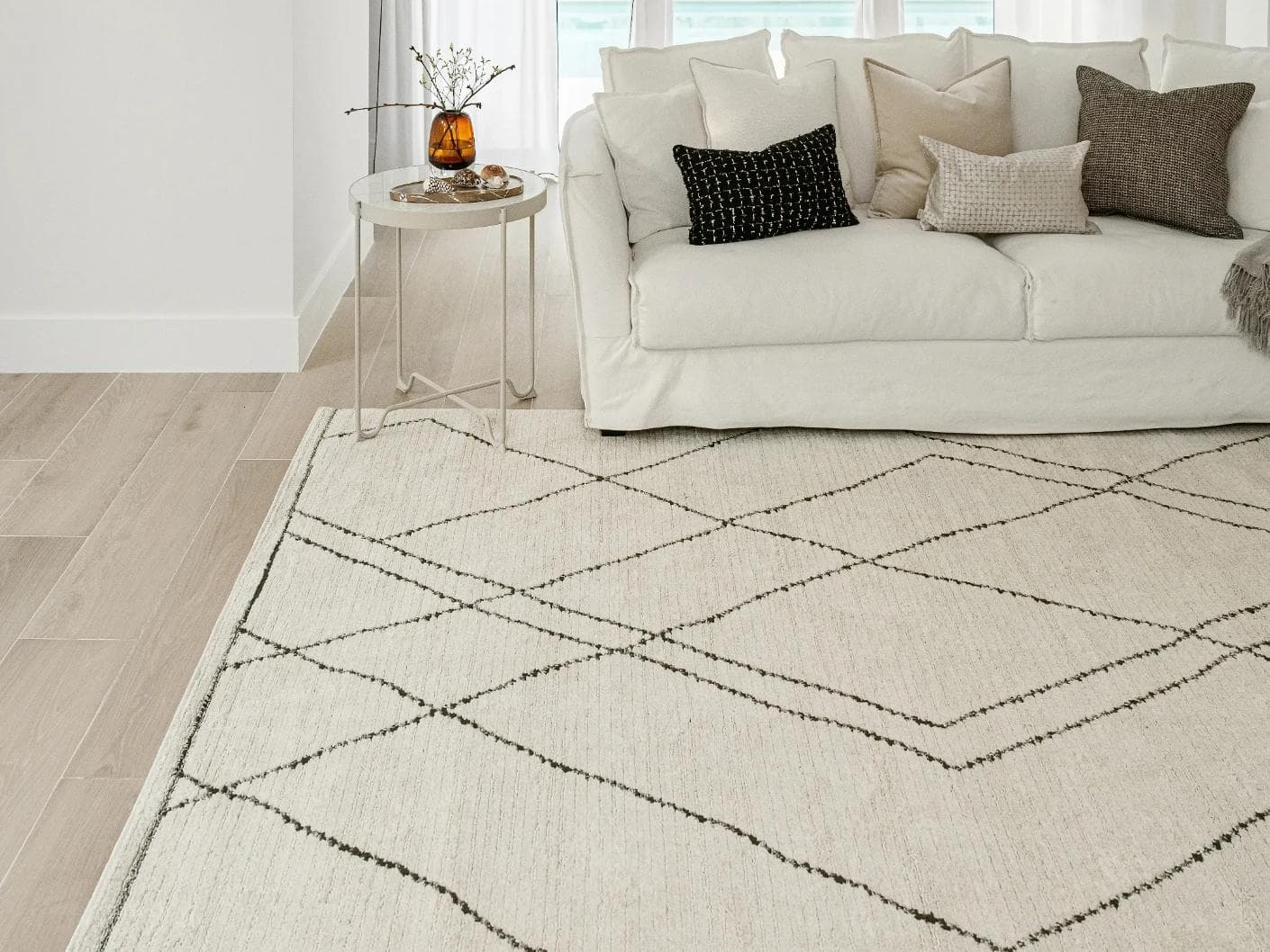 Leila Bianca carpet in beige and charcoal, shown in a lifestyle front view as image 5