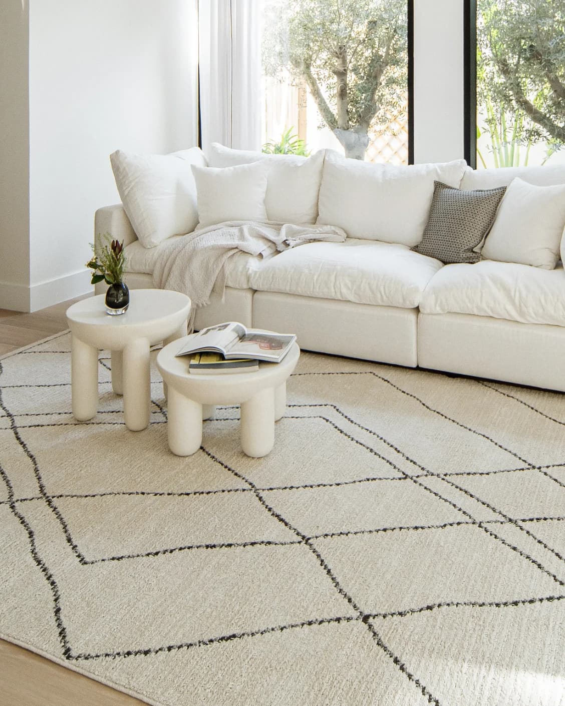 Leila Bianca carpet in beige and charcoal, shown in a lifestyle right view as image 10