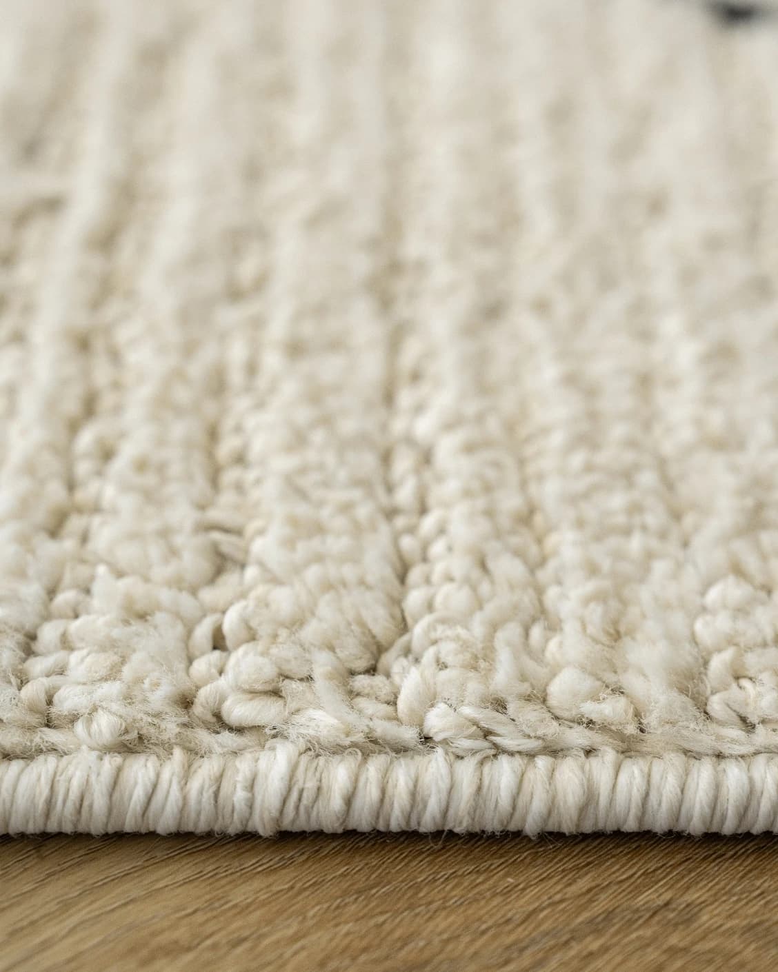 Leila Bianca carpet in beige and charcoal, shown in a product close-up as image 14