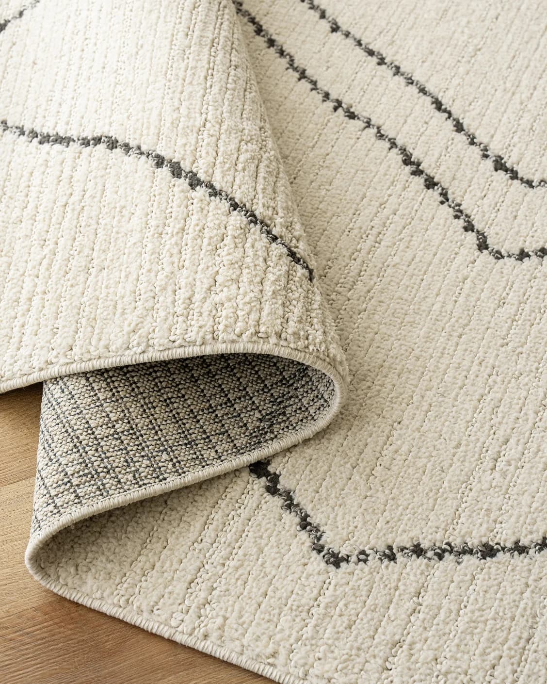 Leila Bianca carpet in beige and charcoal, shown in a product close-up as image 16