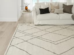 Leila Bianca carpet in beige and charcoal, shown in a lifestyle front view