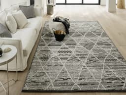 Leila Ebony carpet in ebony, charcoal and white, shown in a lifestyle front view