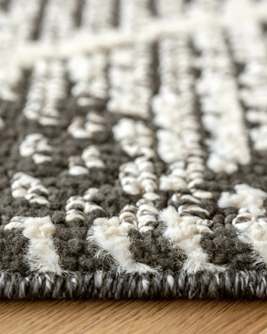 Leila Ebony carpet in charcoal and white, shown in a lifestyle close-up as image 4