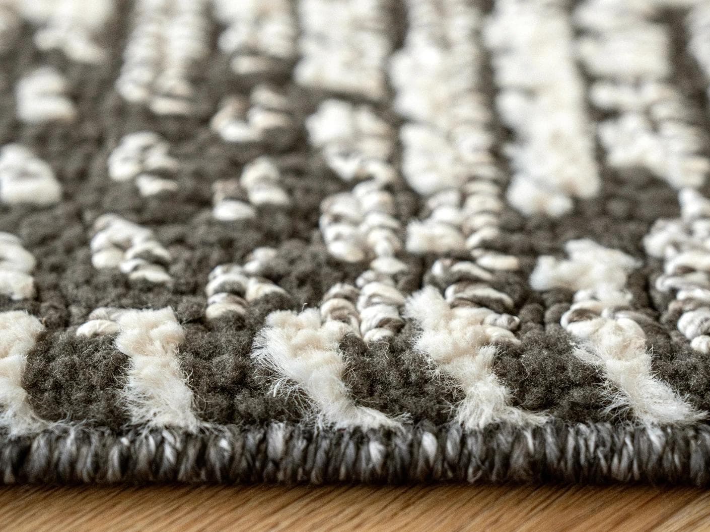 Leila Ebony carpet in charcoal and white, shown in a lifestyle close-up as image 4