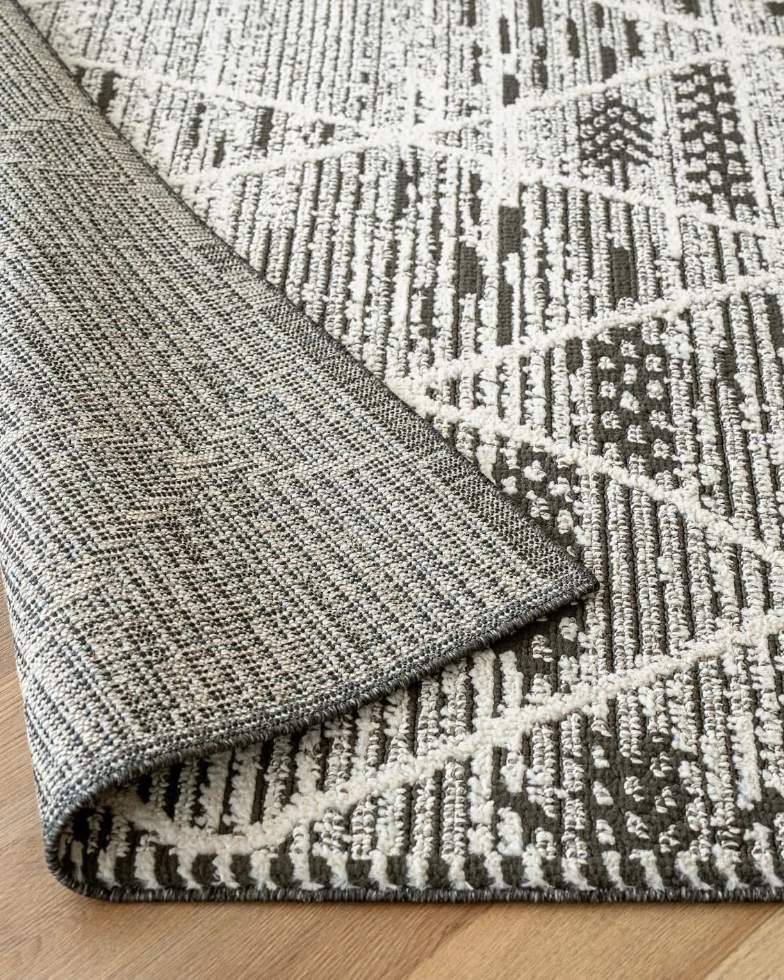 Leila Ebony carpet in charcoal and white, shown in a lifestyle close-up as image 5