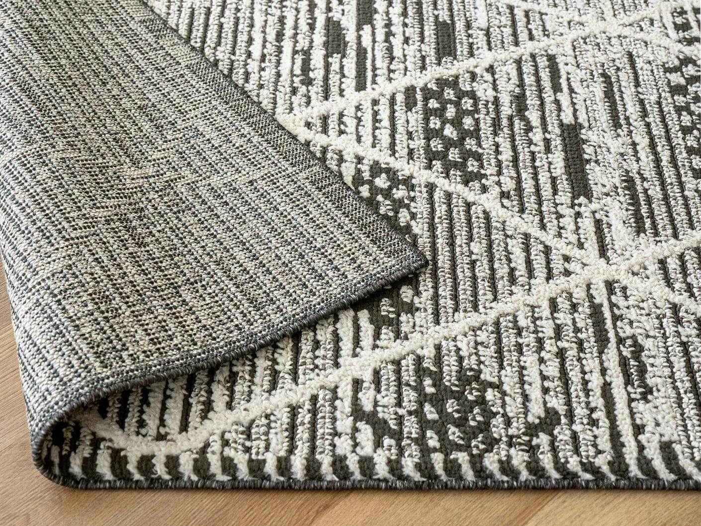 Leila Ebony carpet in charcoal and white, shown in a lifestyle close-up as image 5