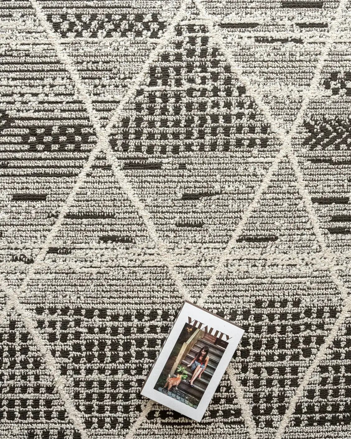 Leila Ebony carpet in charcoal and white, shown in a lifestyle top view as image 11