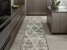 Leila Ebony Runners carpet in ebony, charcoal and white, shown in a lifestyle front view