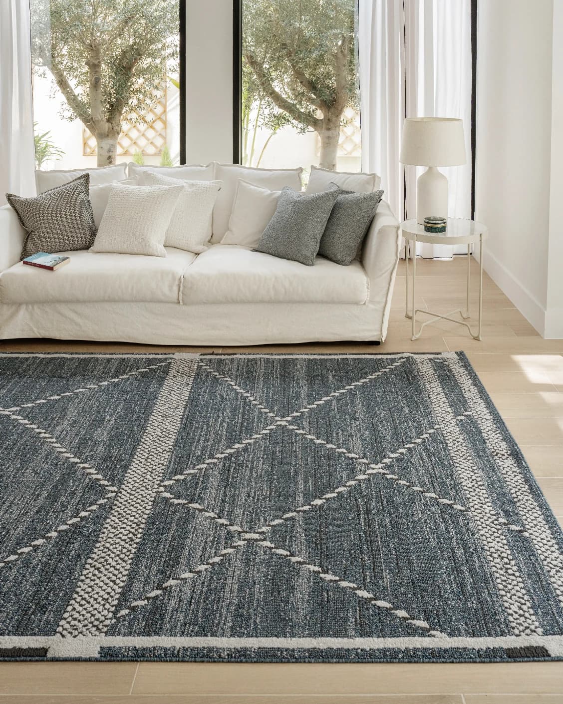 Leila Sky carpet in blue, shown in a lifestyle front view as image 6