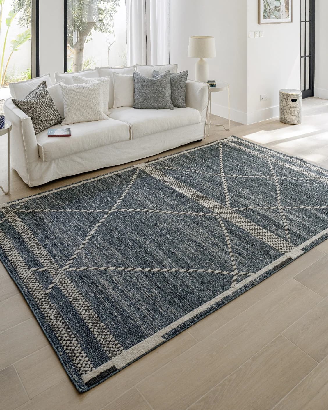 Leila Sky carpet in blue, shown in a lifestyle left view as image 7
