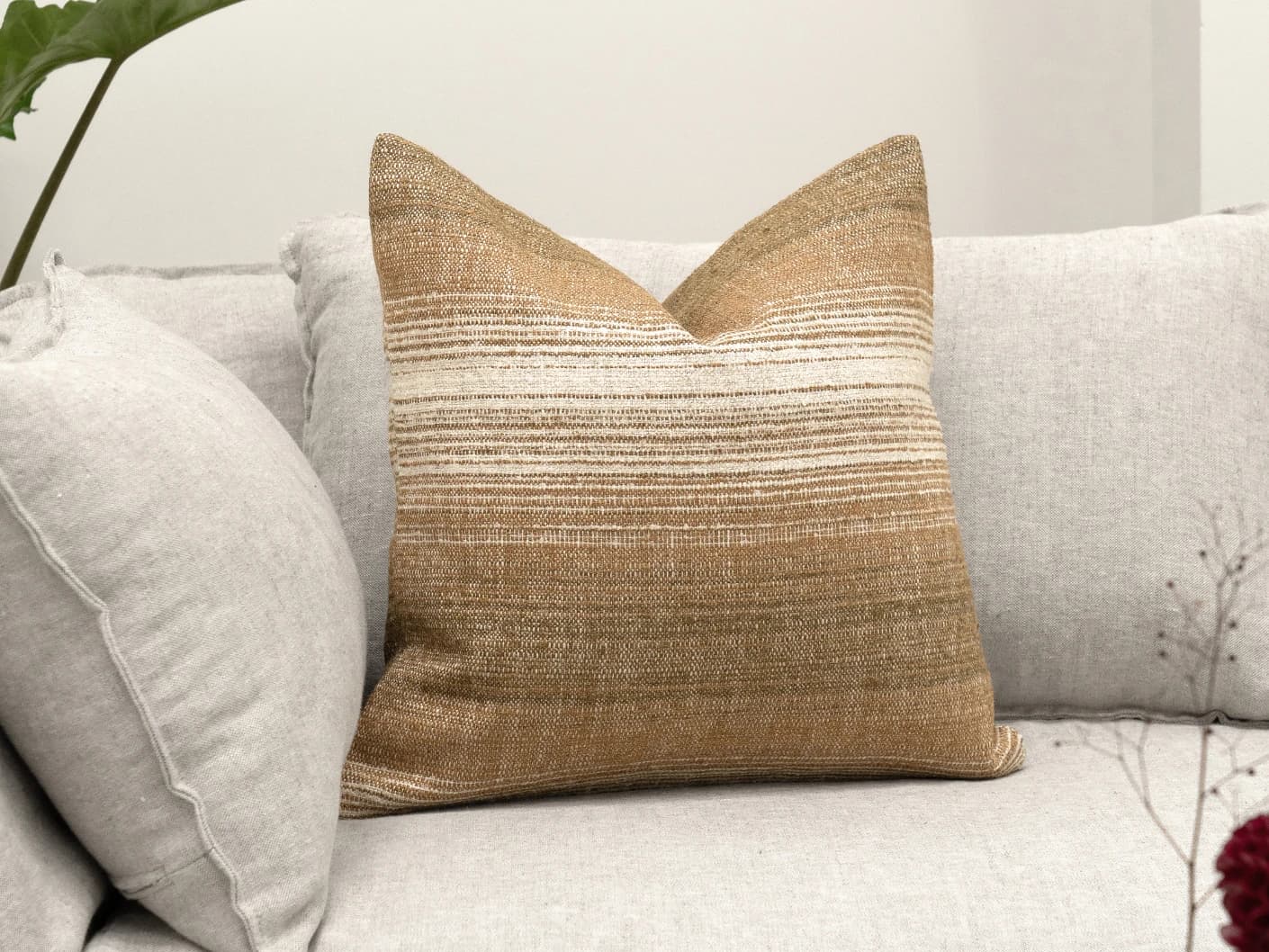 Lia Ember single cushions in brown, shown in a lifestyle front view