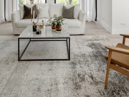Liam Alba carpet in grey, shown in a lifestyle front view