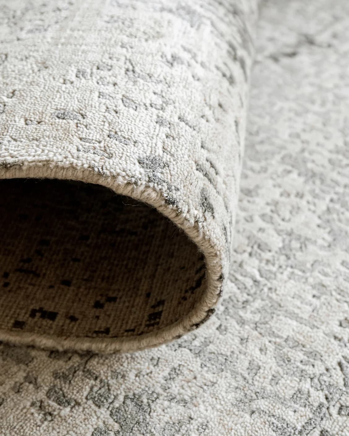 Liam Alba carpet in grey, shown in a lifestyle close-up as image 4