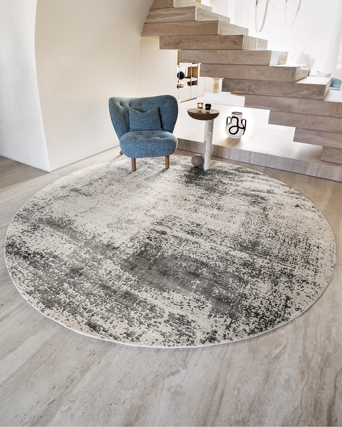 Liam Alba Round carpet in grey, shown in a lifestyle front view as image 2