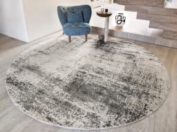 Liam Alba Round carpet in grey, shown in a lifestyle front view