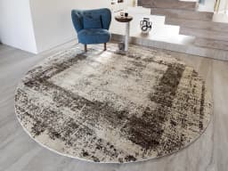 Liam Amber Round carpet in beige, shown in a lifestyle front view