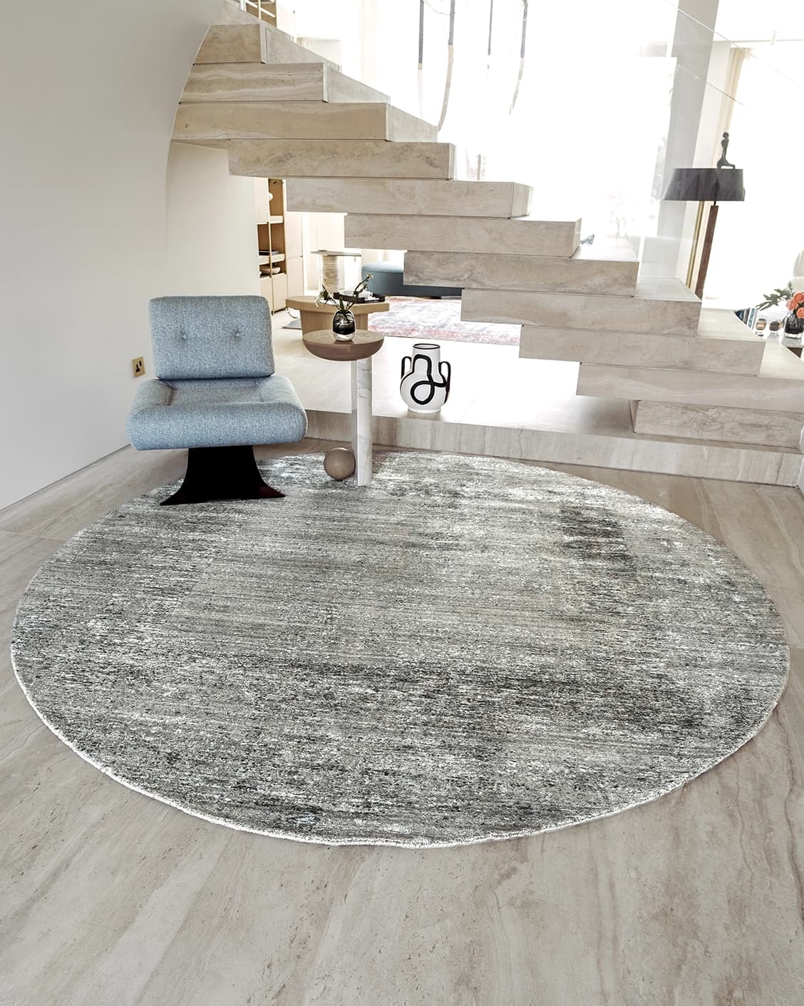 Liam Ashton Round carpet in grey, shown in a lifestyle front view as image 2