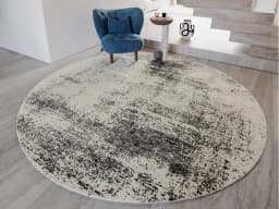Liam Bianca Round carpet in grey, shown in a lifestyle front view