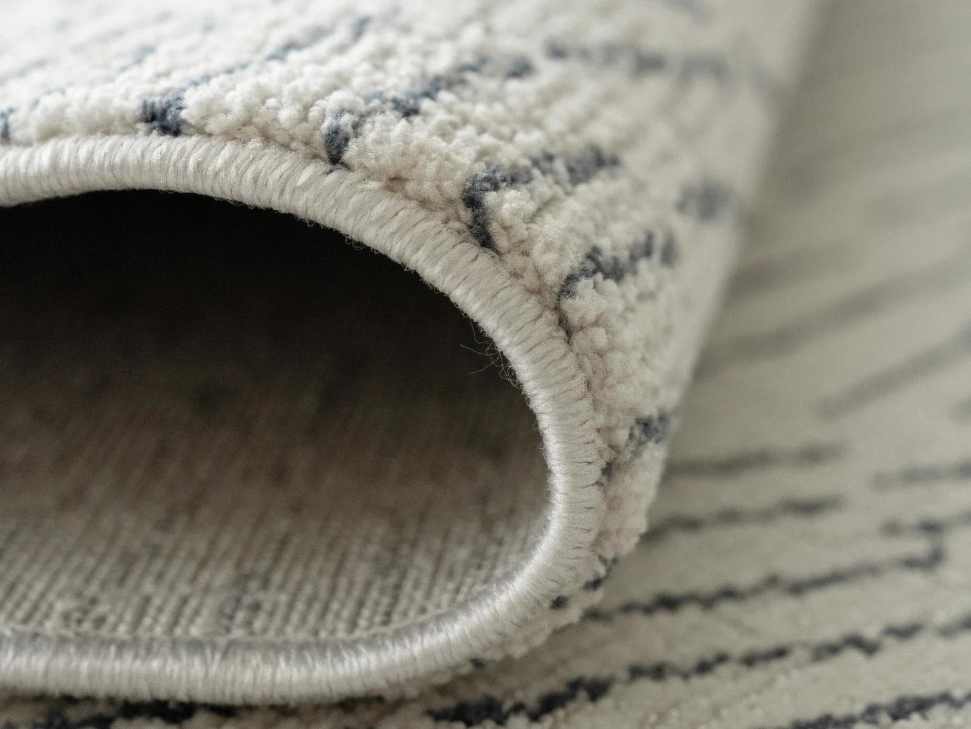 Link Fume carpet in grey, shown in a product close-up as image 12