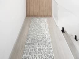 Link Fume Runners carpet in grey, shown in a lifestyle front view