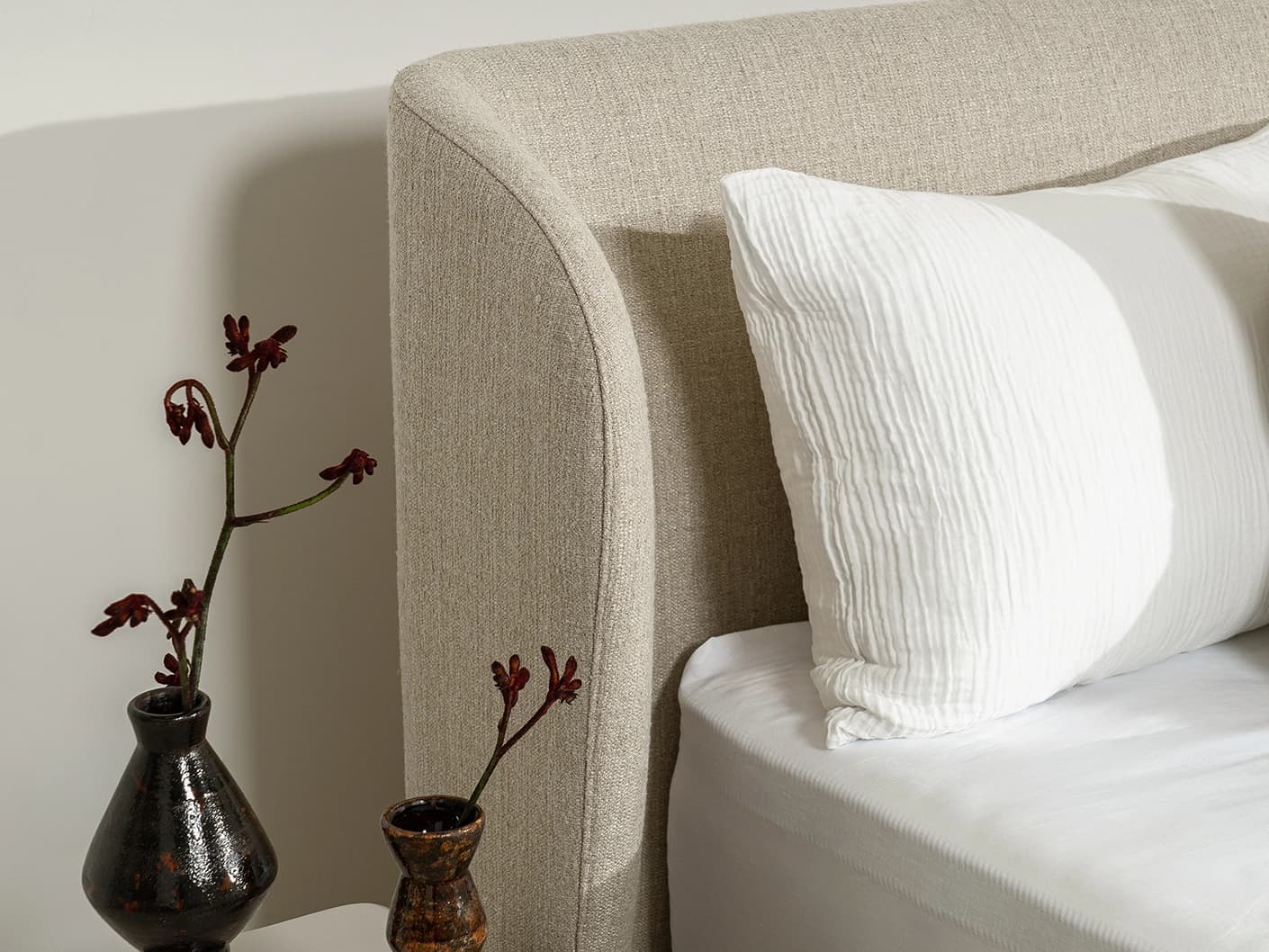 Livia Warm Mushroom bed frame, shown in a product left view as image 8