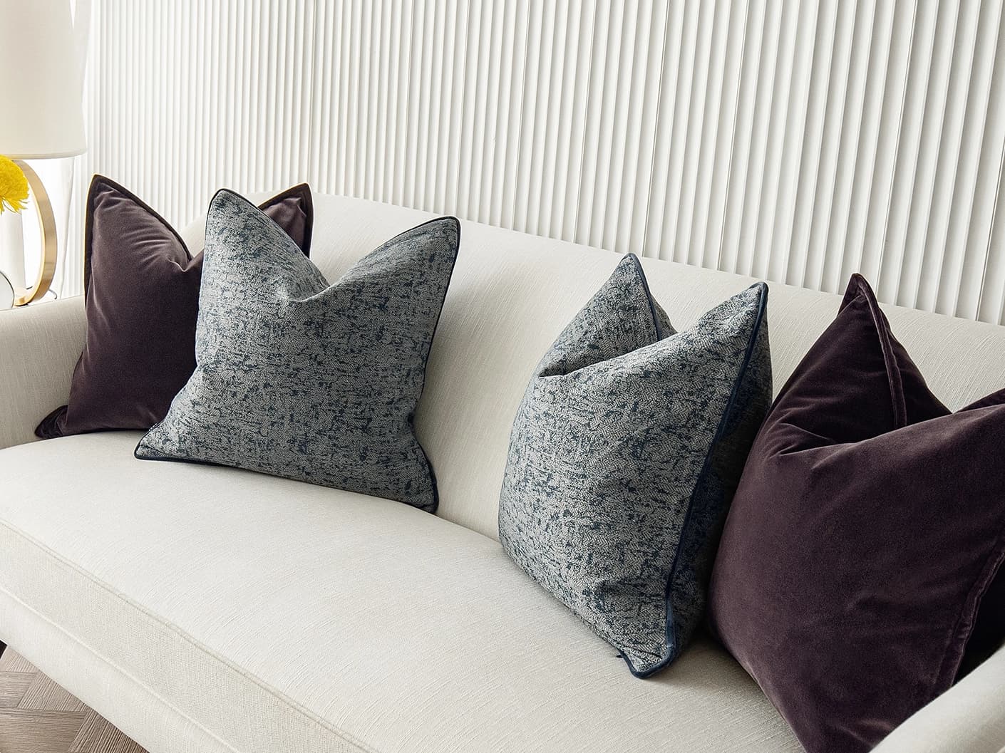 Lolanthe Bundle bundle cushions in blue and purple, shown in a lifestyle front view