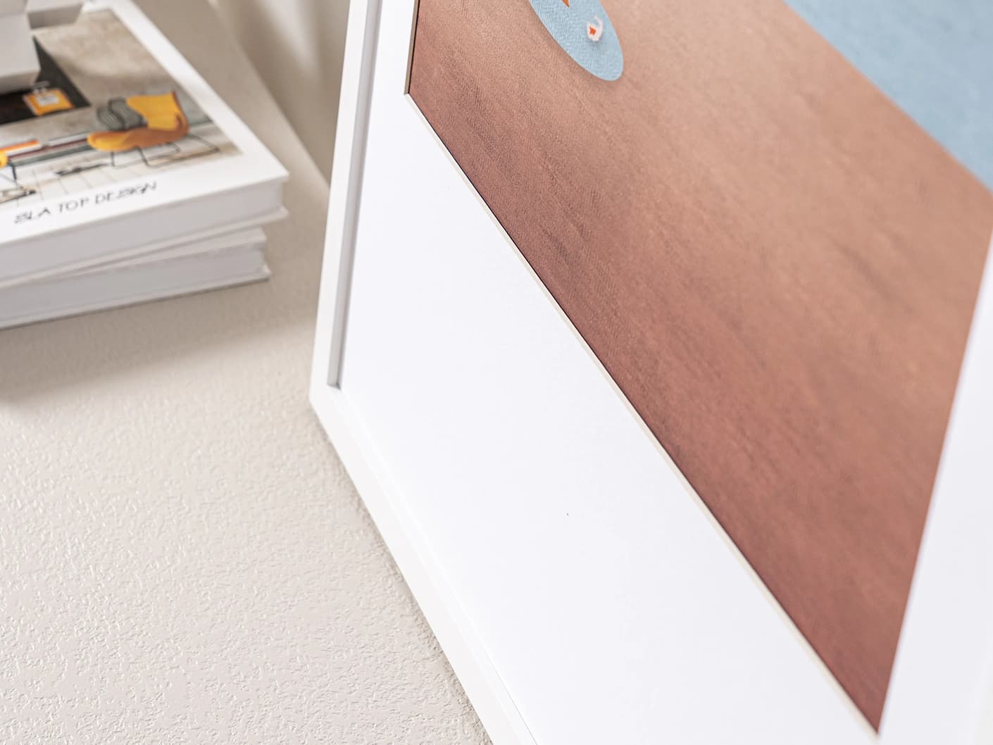 Lone Tree fine art print in blue and beige, shown in a lifestyle close-up view as image 2