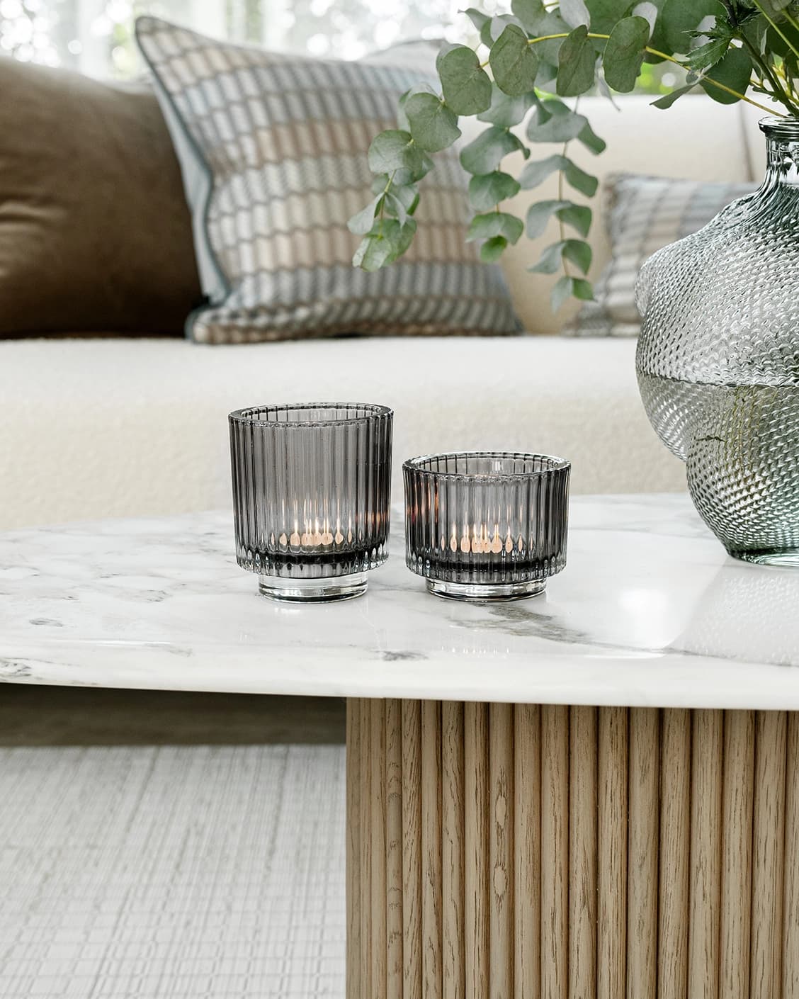Loucille Storms candle holders in grey, shown in a lifestyle front view as image 2