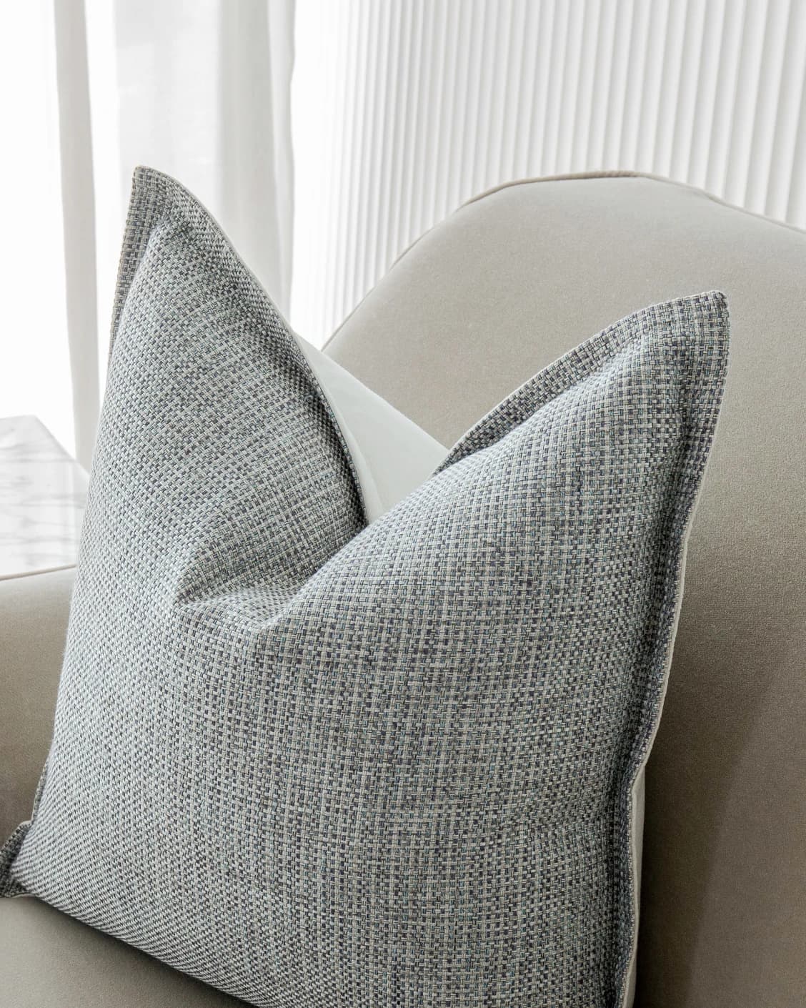 Luis Canova cushions in blue, shown in a lifestyle top view as video image